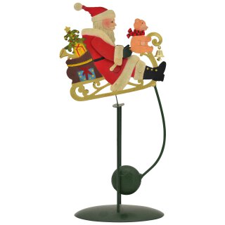 dekorativer weihnachtlicher Nikolaus als nostalgische Wipp-Figur im Antik-Look mit Schlitten
