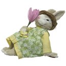 frühlingshafter putziger Deko-Hase Osterhase aus Gras als Hasenjunge mit Hut oder Hasenmädchen mit Blume